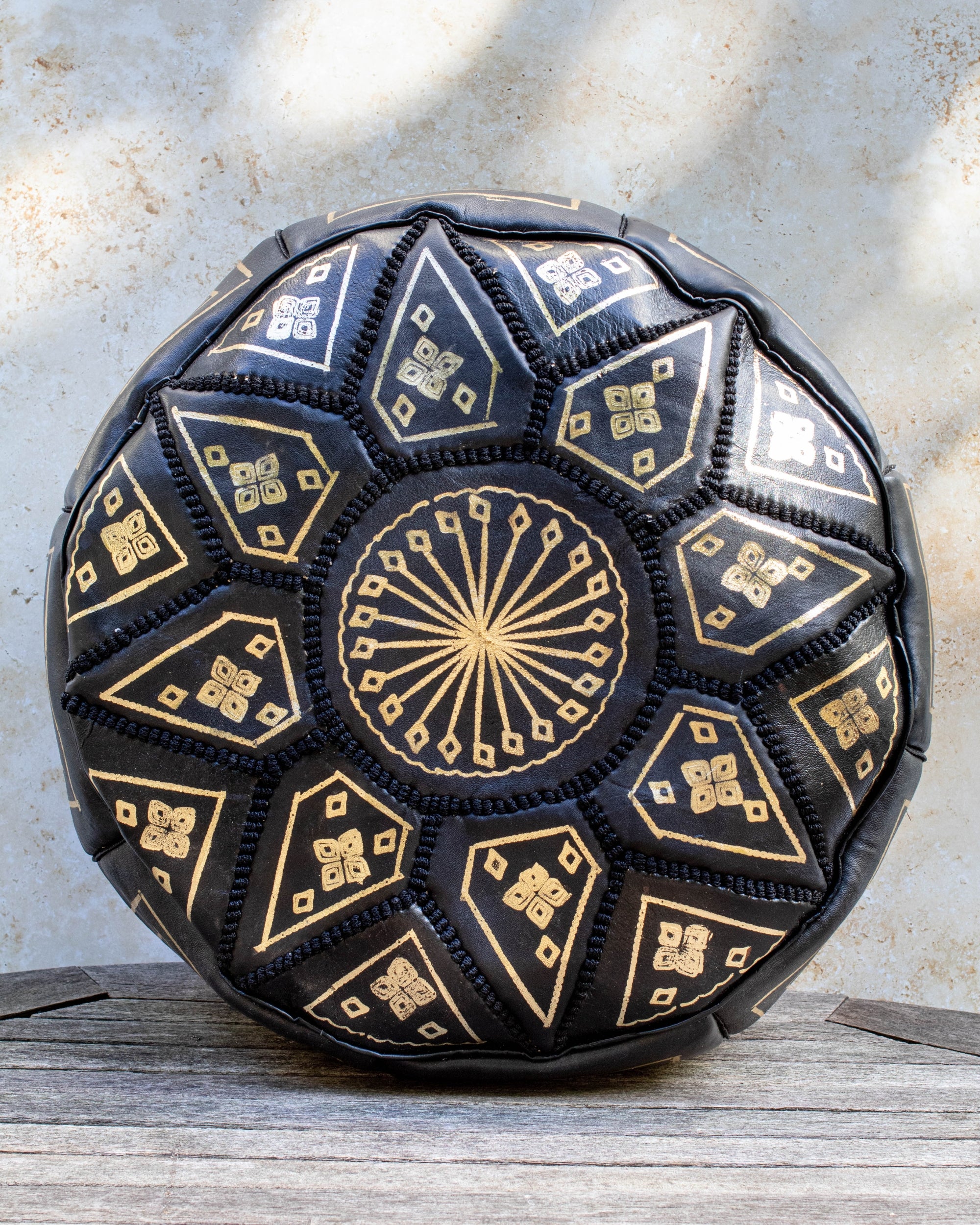 Black Moroccan leather pouf with gold embroidery front view
