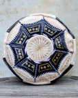 Black and cream Moroccan leather pouf with gold embroidery – front view