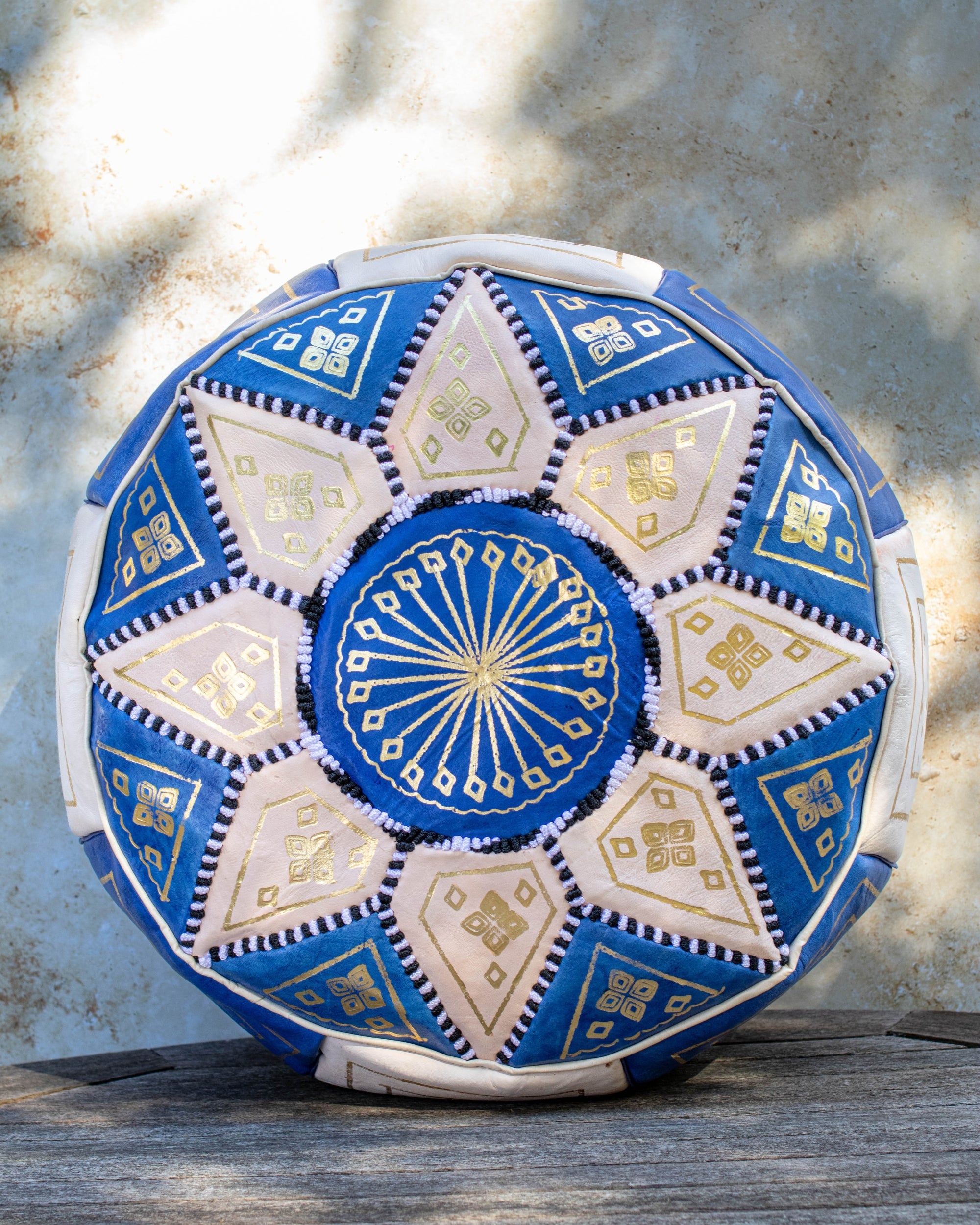 Blue and cream Moroccan leather pouf with gold embroidery front view