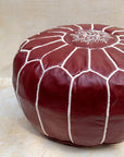 Burgundy leather pouf – hand-stitch detail close-up