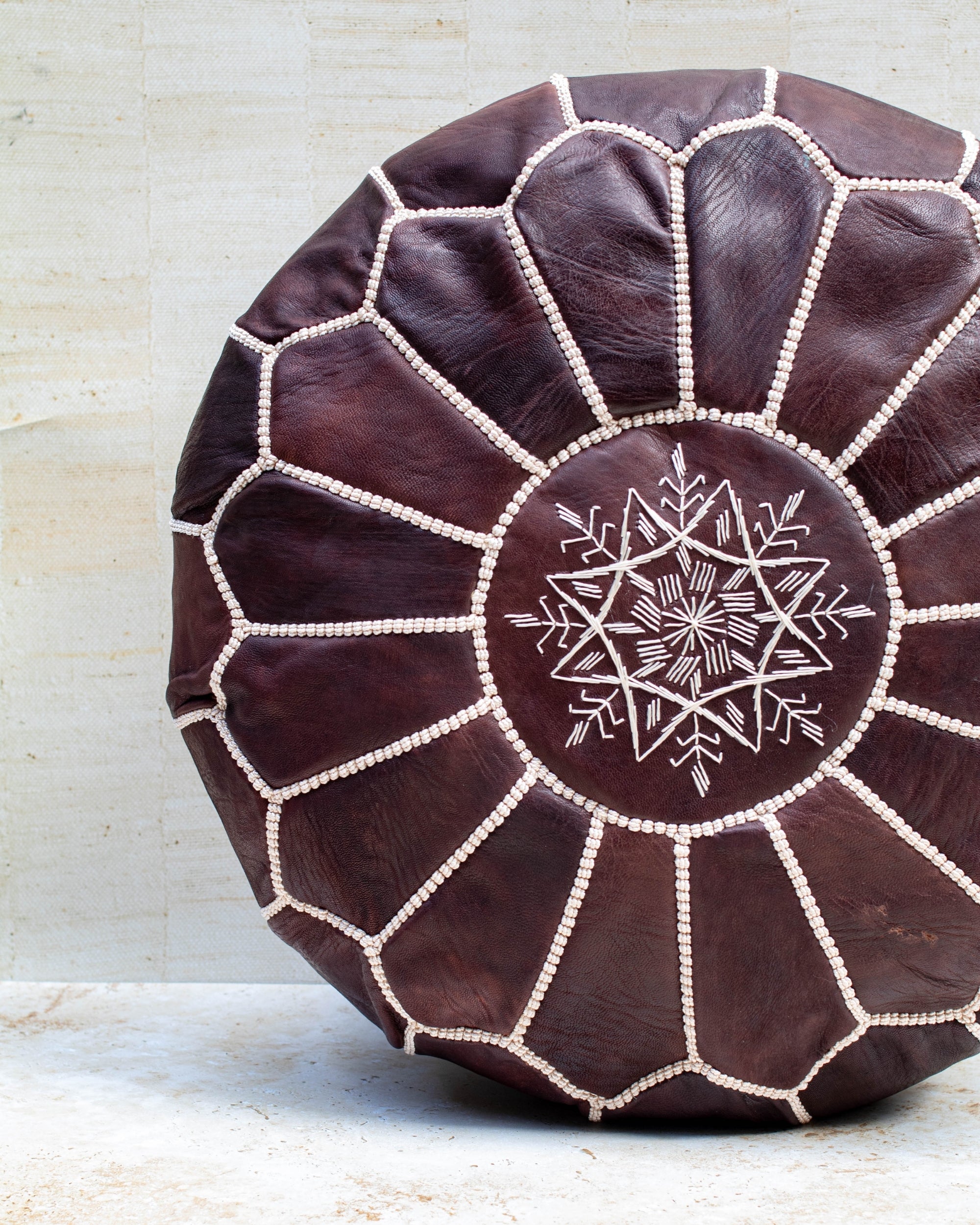 Chocolate leather pouf stitch detail close-up