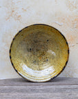 Close-up of scalloped rim and gloss finish