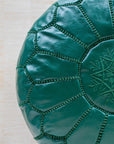 Emerald green leather pouf – hand-stitch detail close-up