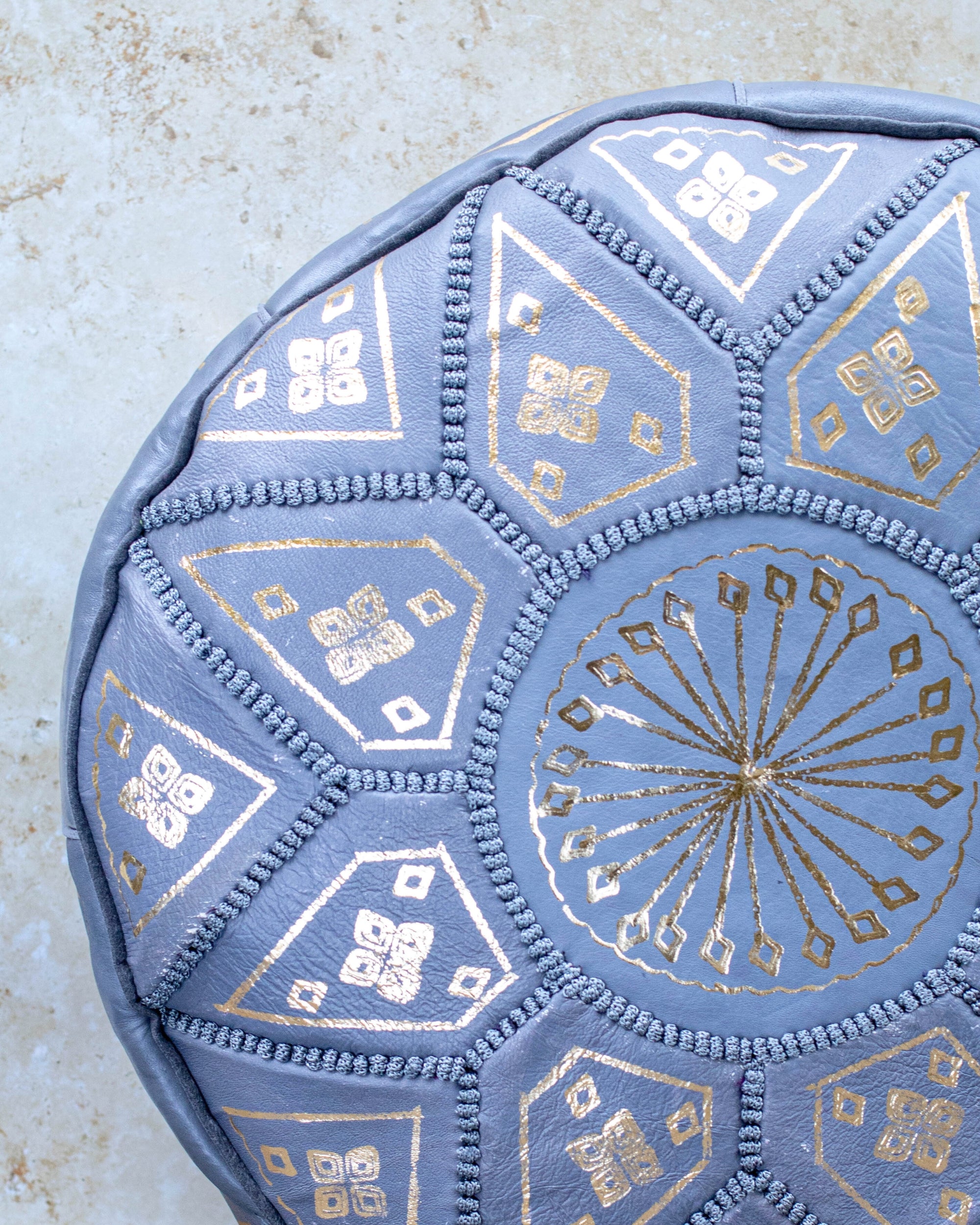 Hand-stitched grey leather pouf – embroidery detail close-up