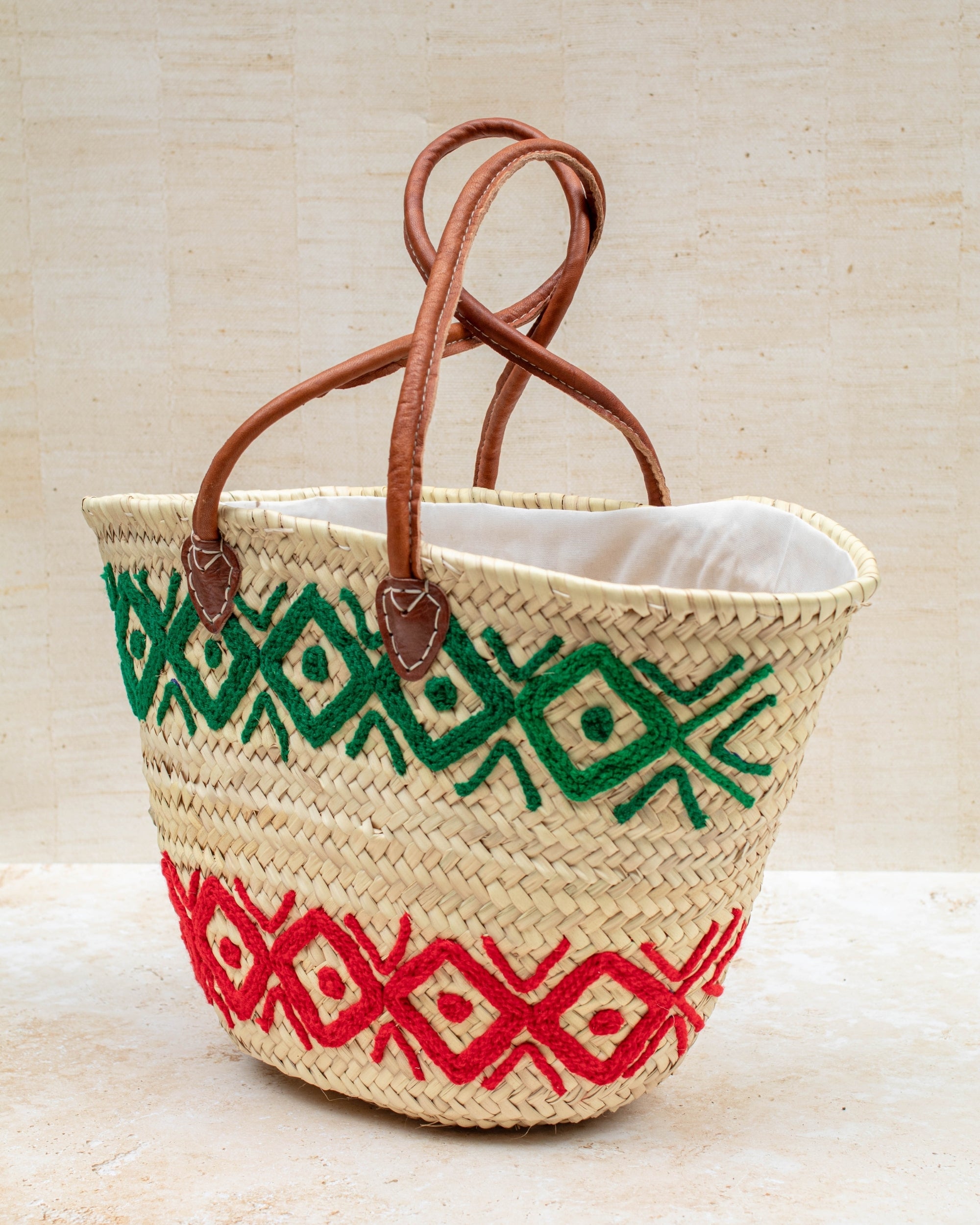 Handwoven French market basket – green and red embroidery, front view