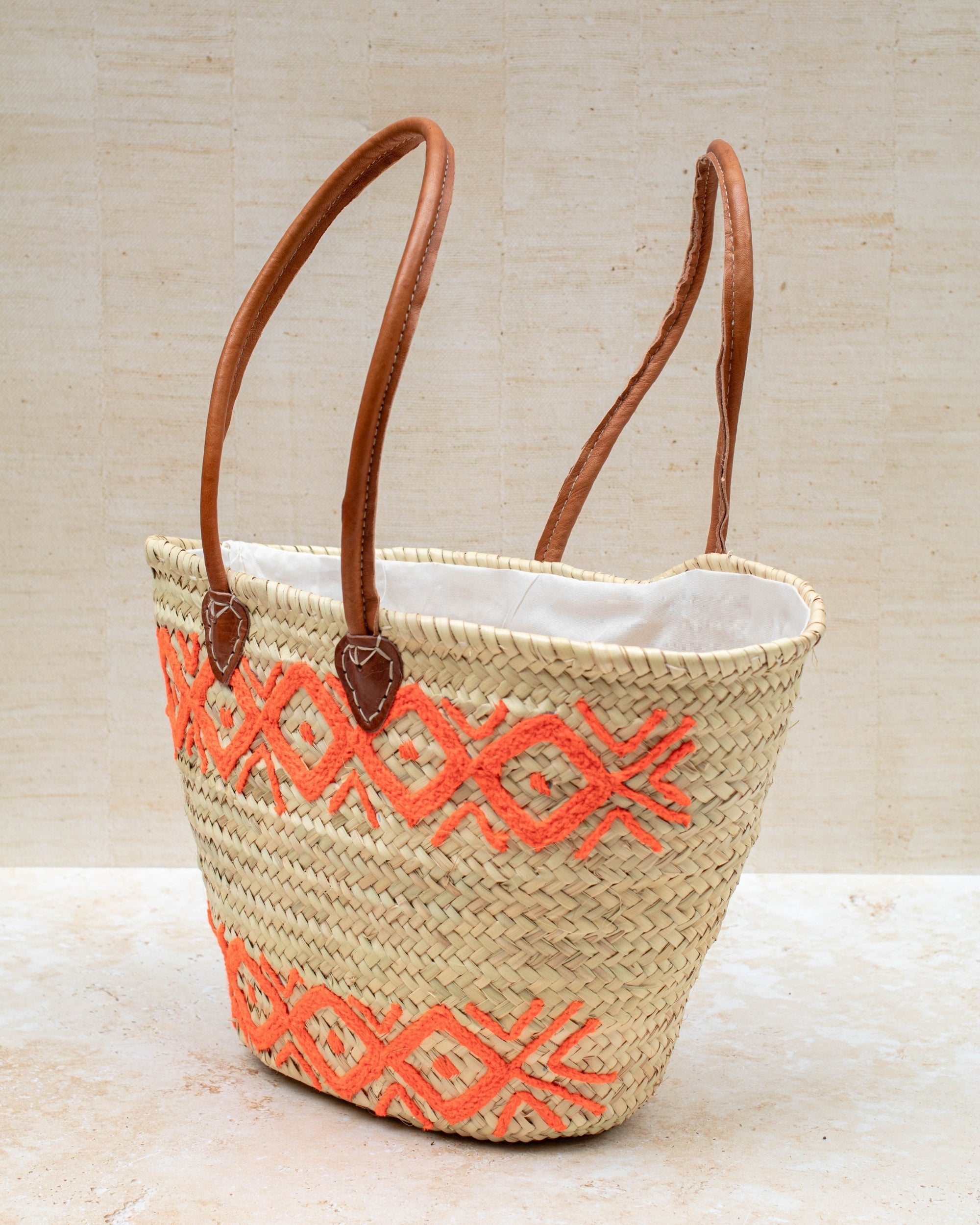 Handwoven French market basket – orange embroidery, front view