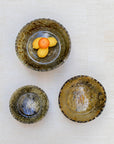 Large ochre bowl used as fruit bowl on kitchen island