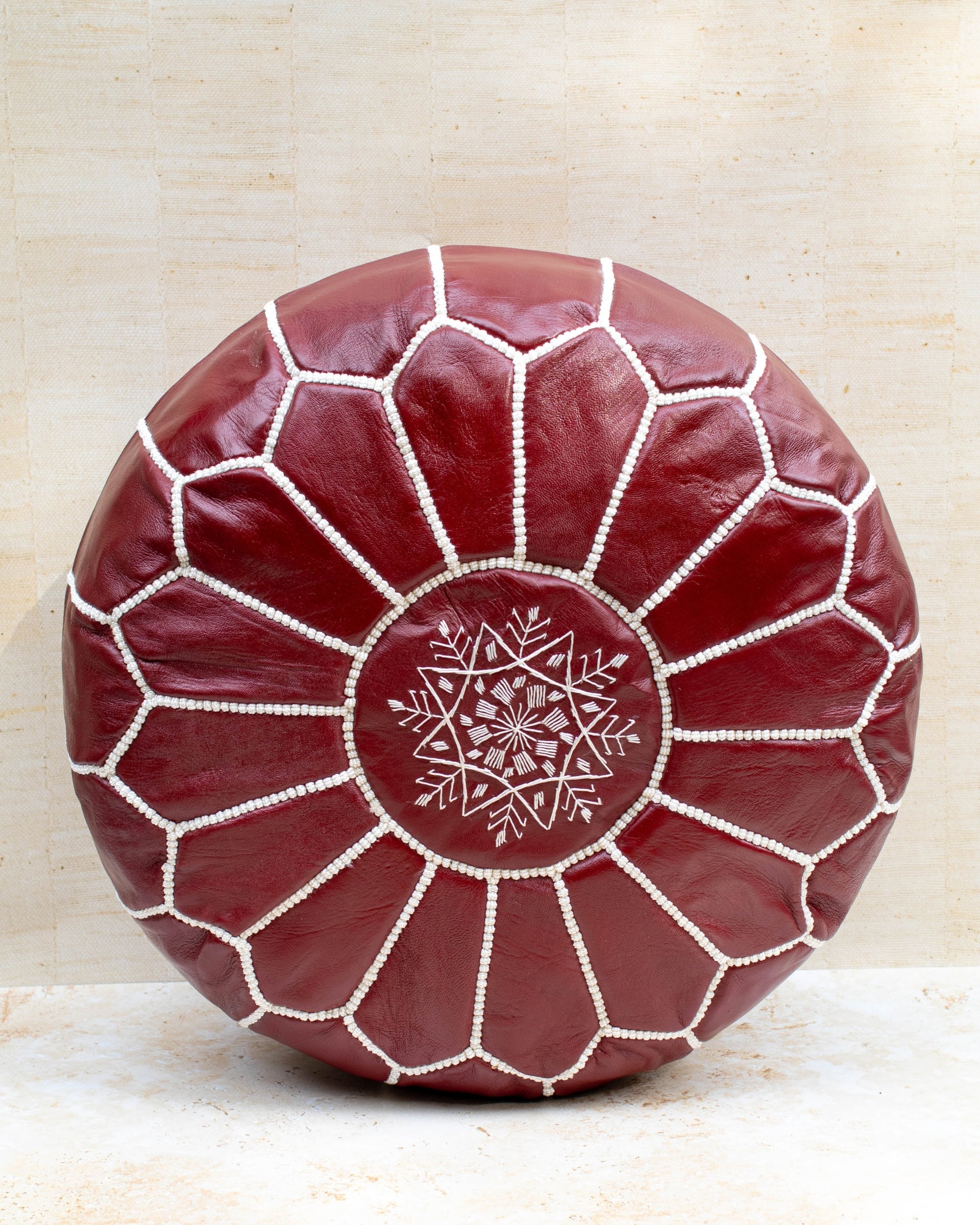 Moroccan leather pouf – burgundy, front view