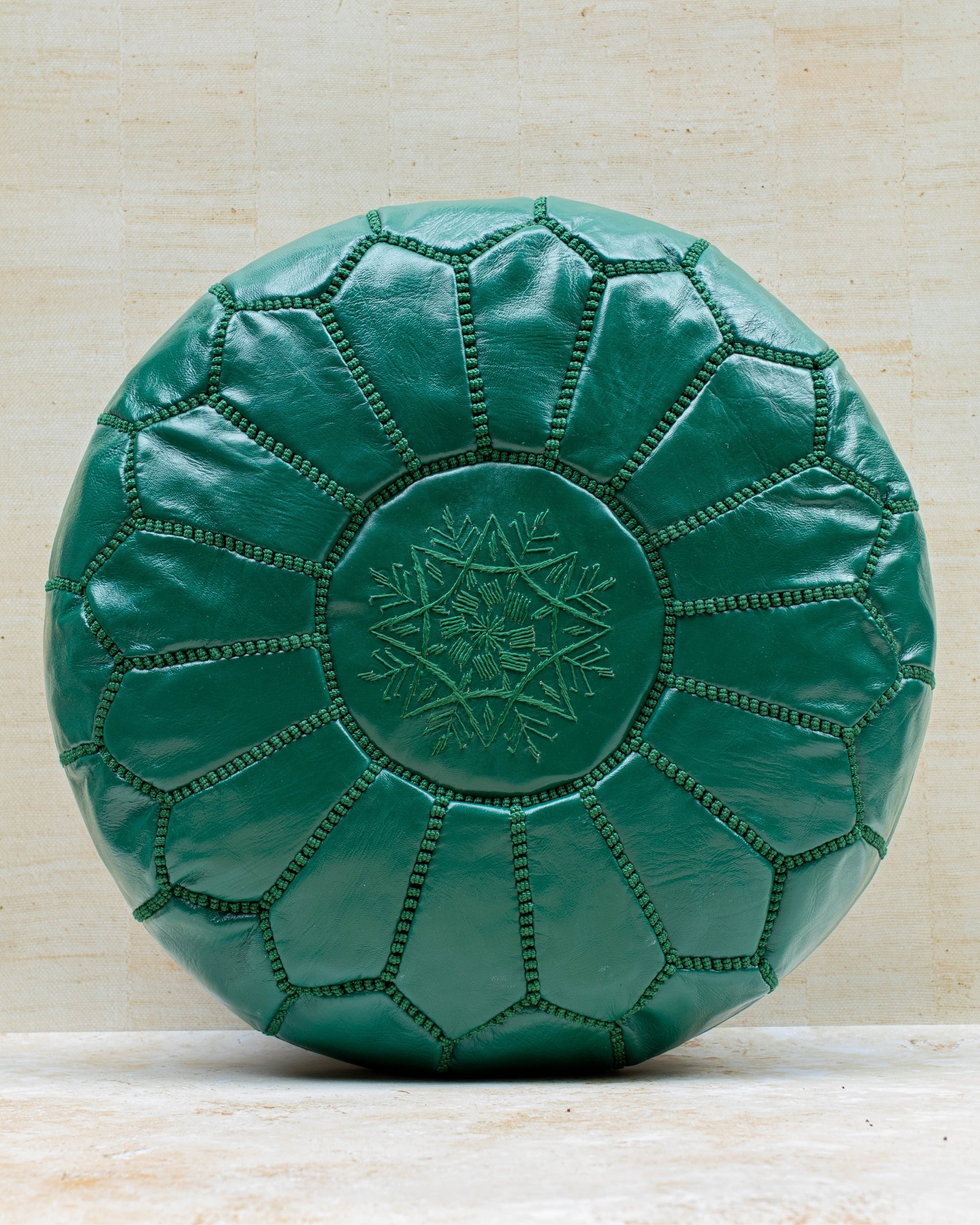 Moroccan leather pouf – emerald green, front view