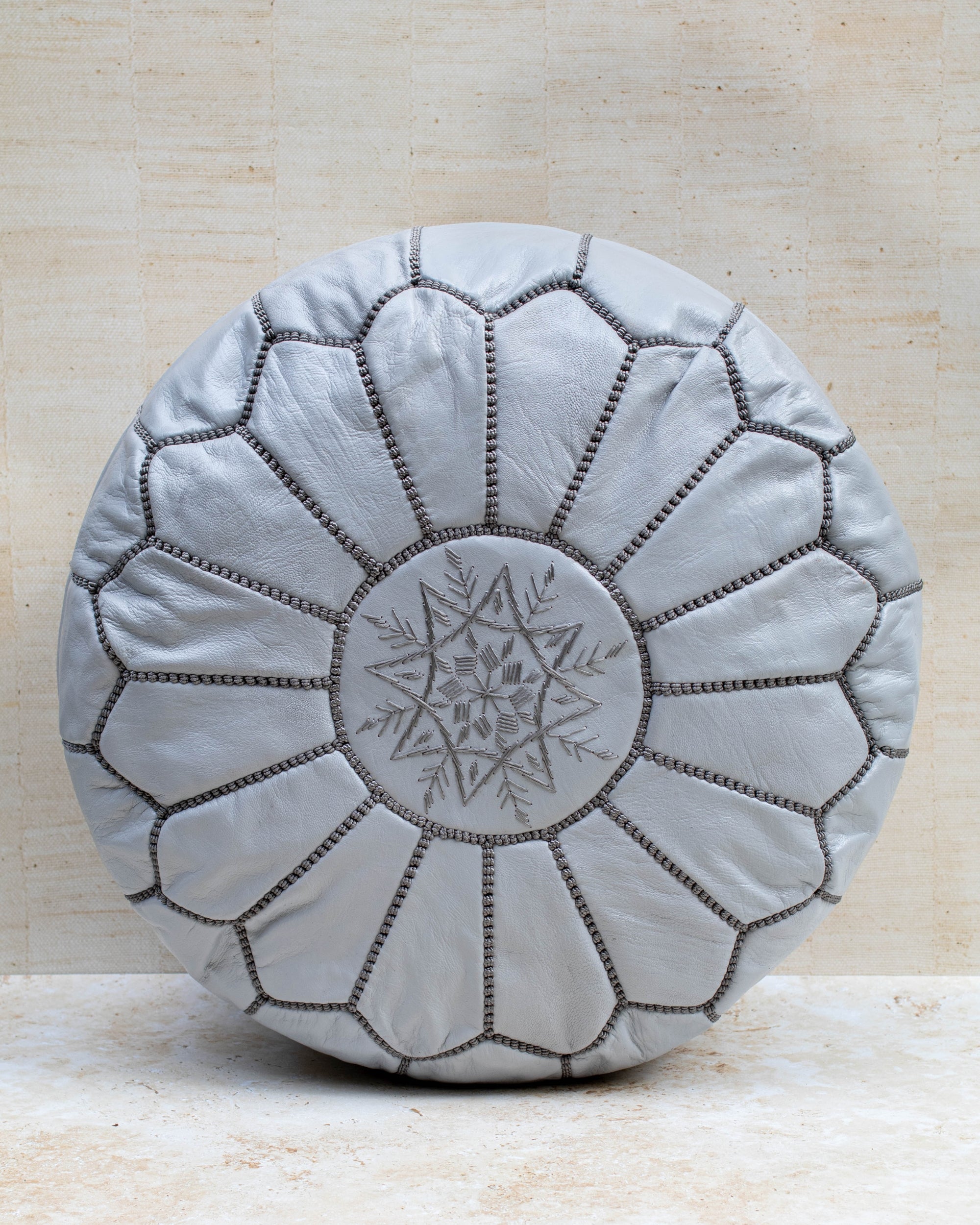 Moroccan leather pouf – grey, front view