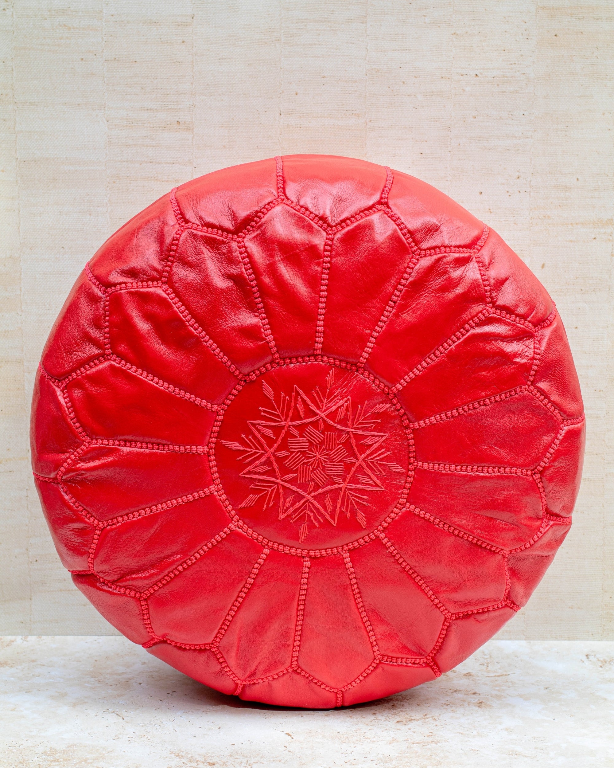 Moroccan leather pouf – red, front view
