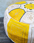 Moroccan leather pouf styled in living room