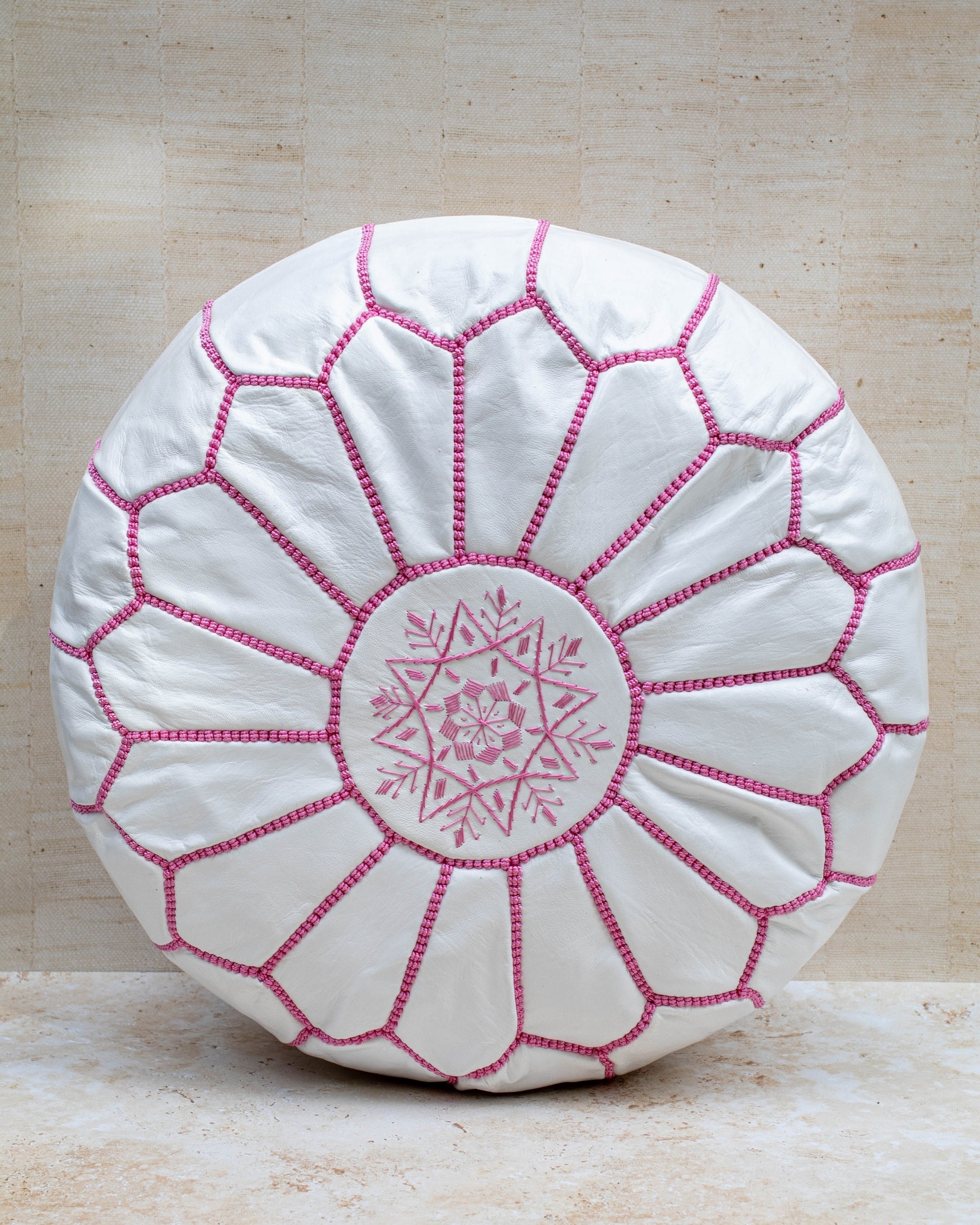 Moroccan leather pouf – white with pink stitching, front view