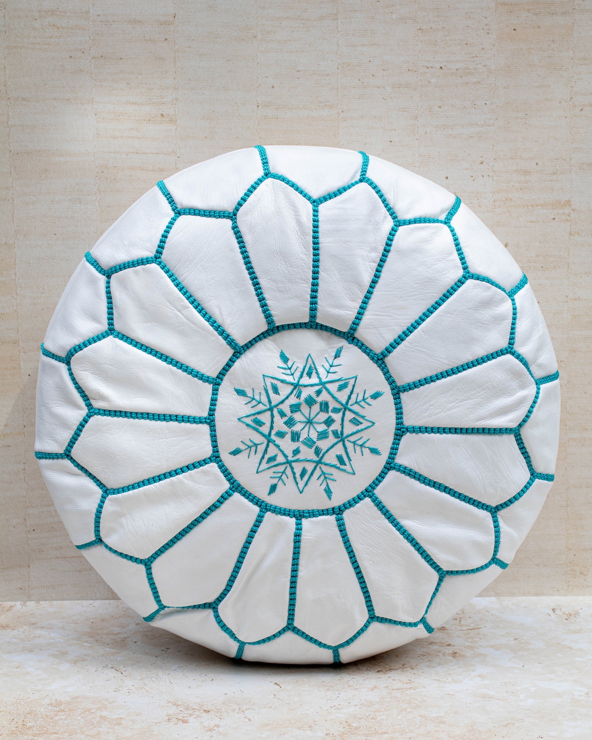 Moroccan leather pouf – white with turquoise stitching, front view