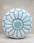 Moroccan leather pouf – white with turquoise stitching, front view