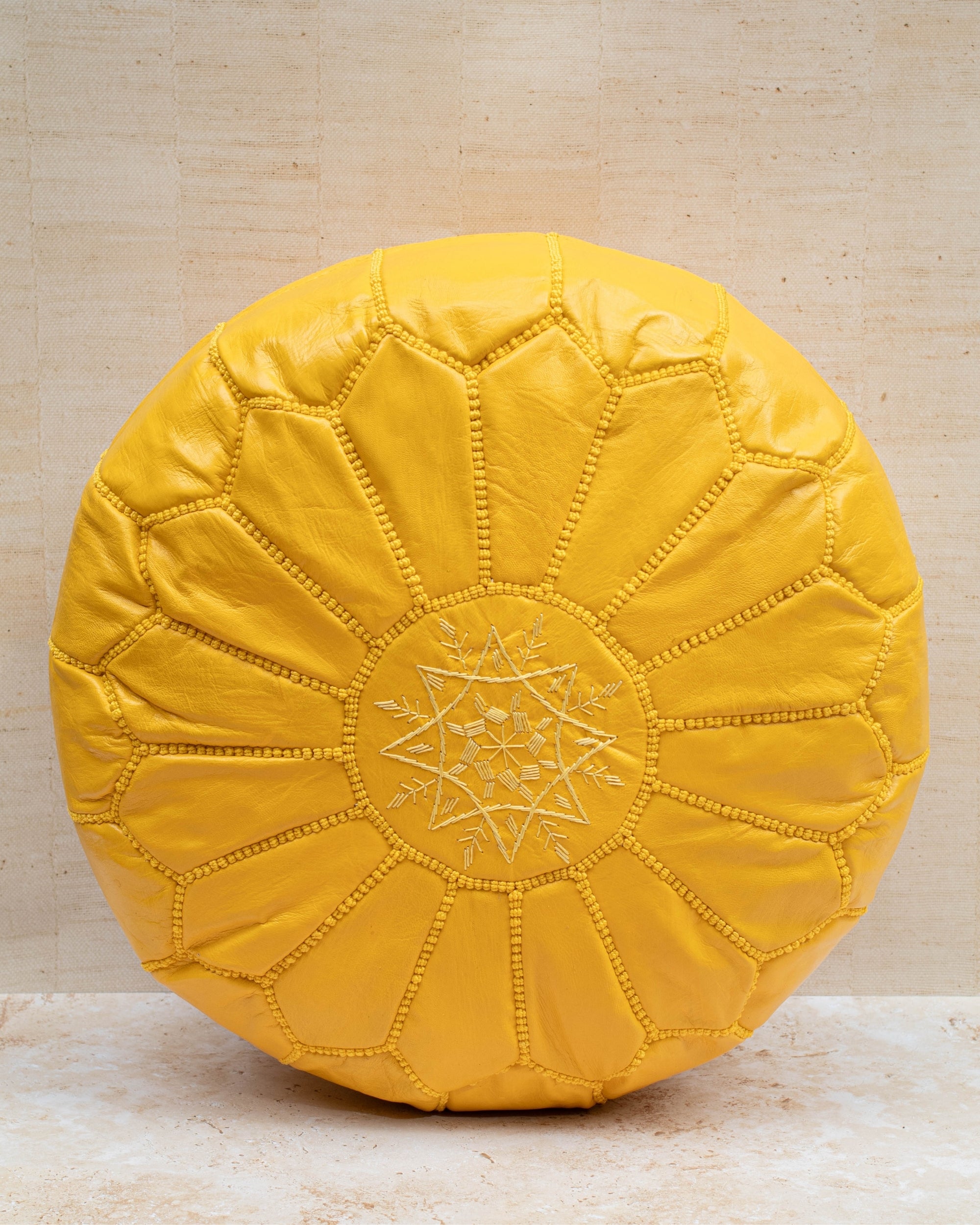 Moroccan leather pouf – yellow, front view