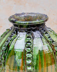 Moroccan pottery vase with ribbed relief and green glaze