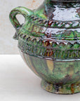 Moroccan pottery vase with textured surface and deep glaze