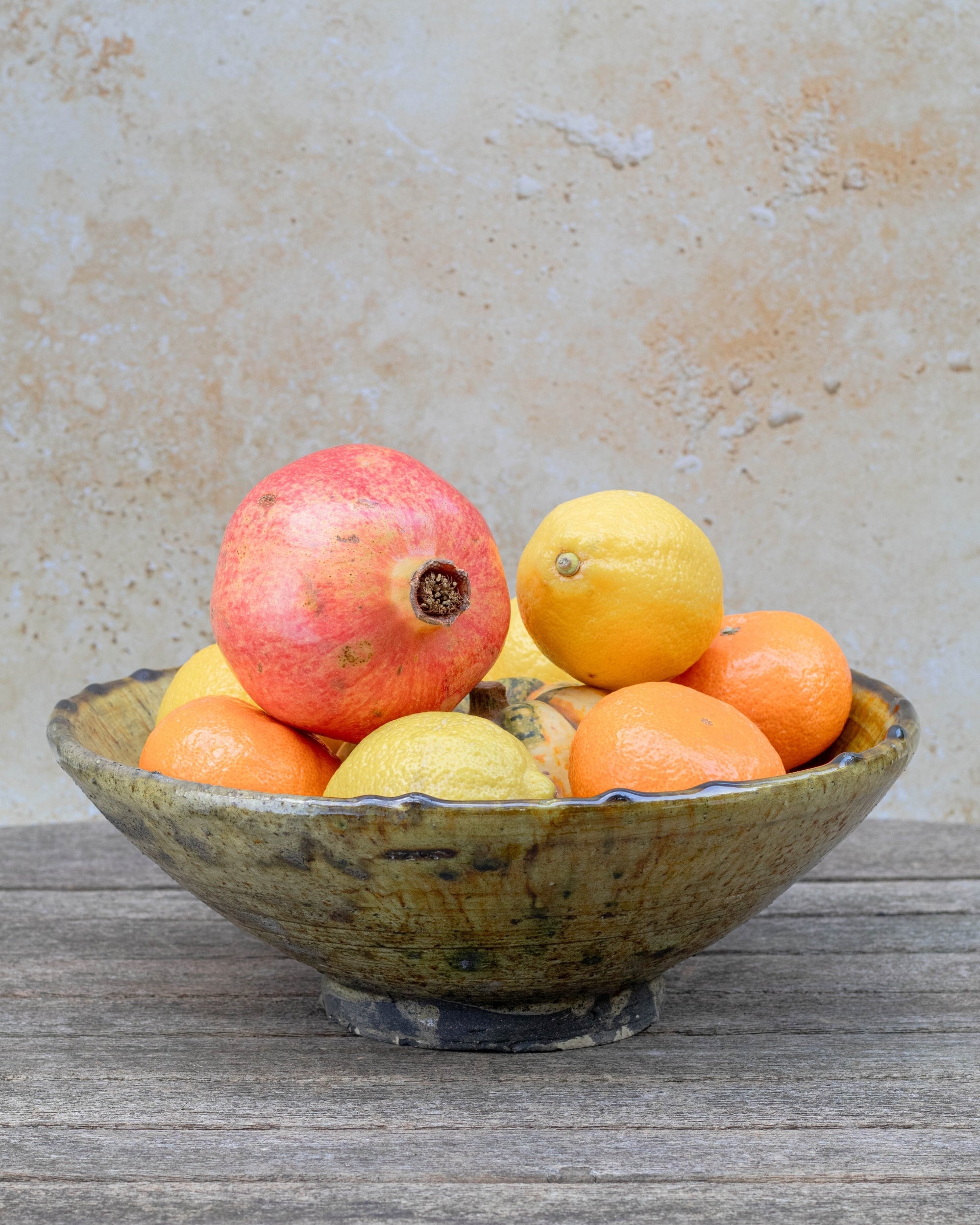 Moroccan serving bowl used for fruit on rustic table