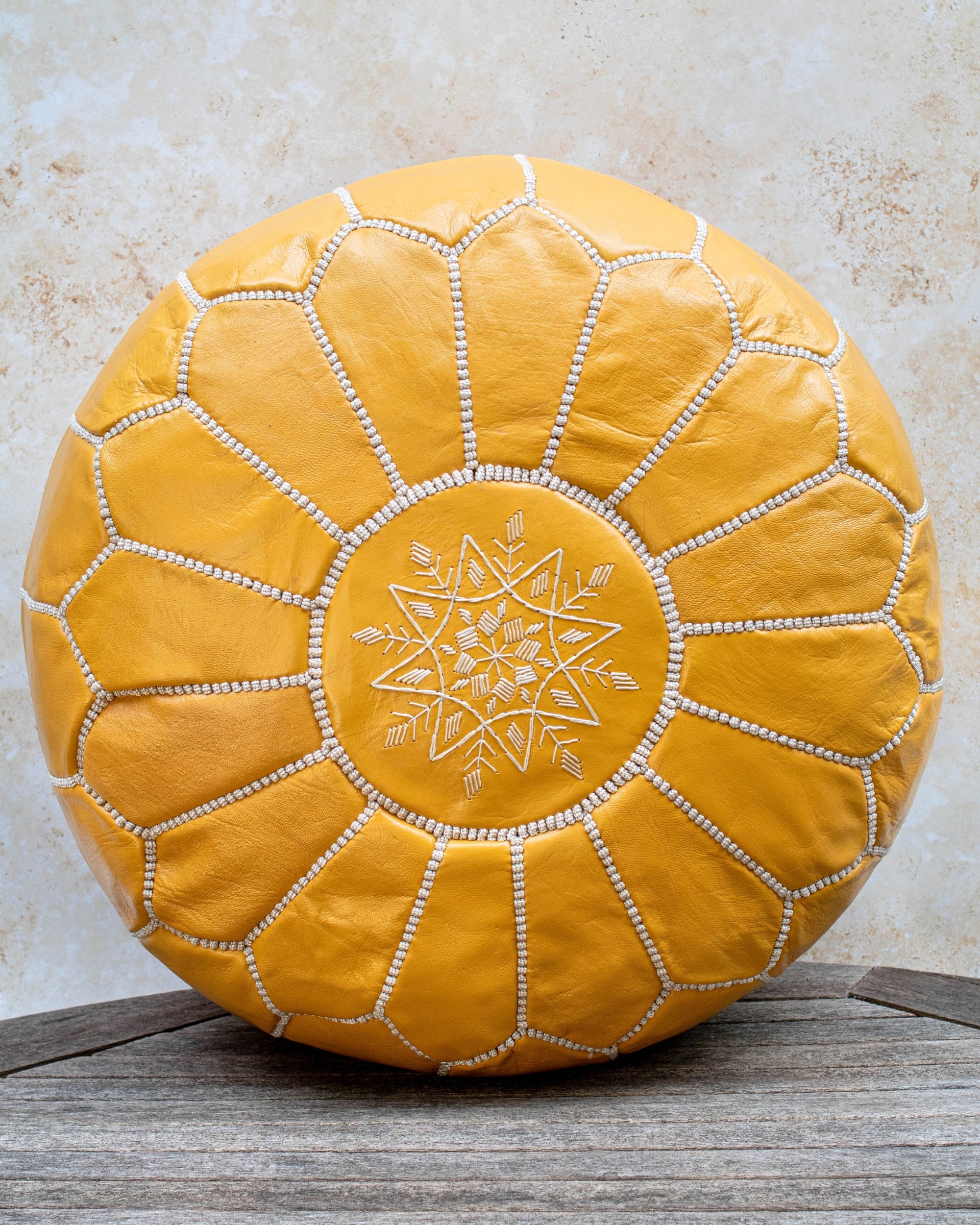 Mustard yellow Moroccan leather pouf front view