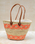Orange embroidery basket styled for summer shopping