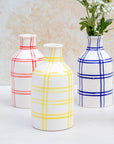 Red checkered vase with flowers