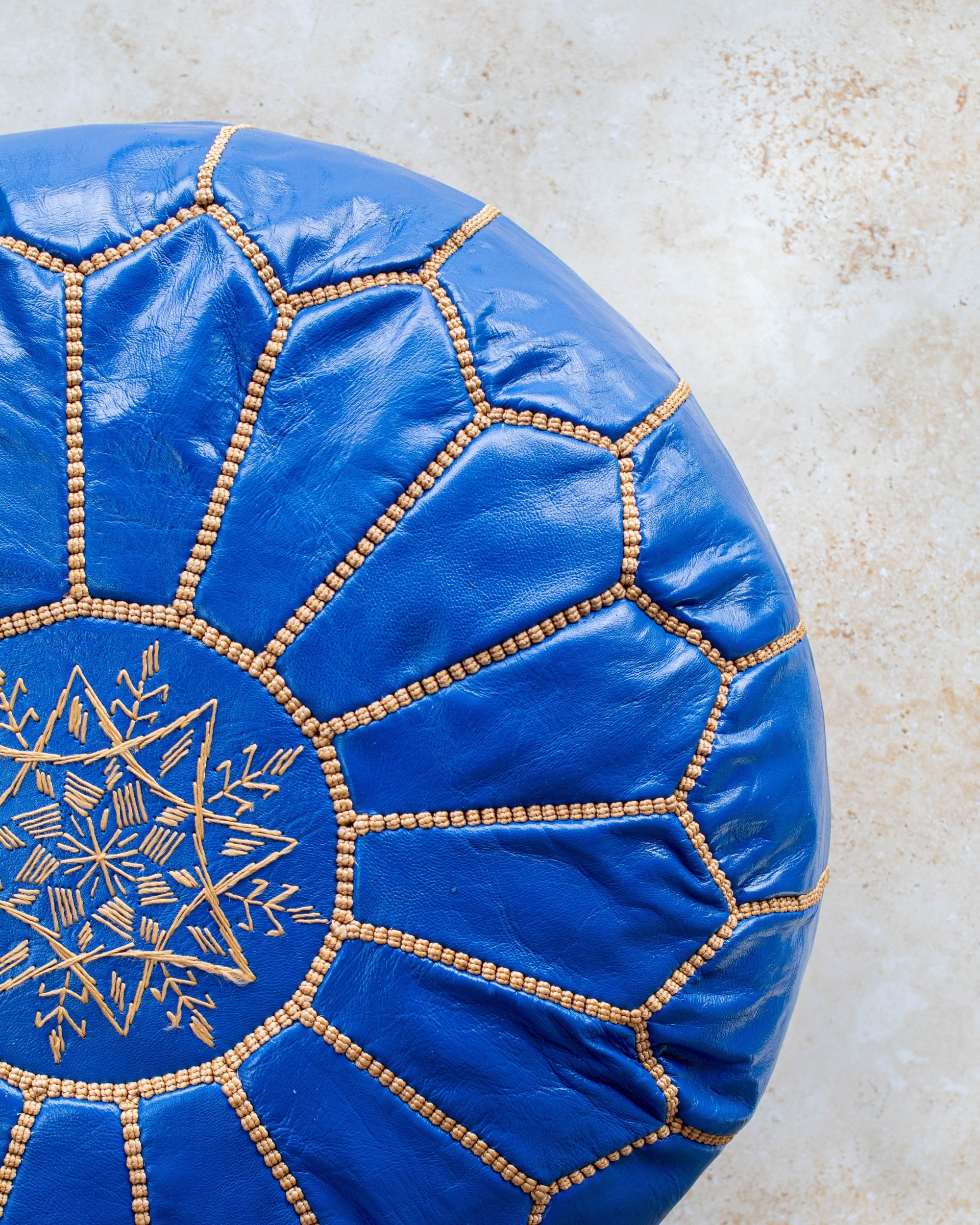 Royal blue leather pouf zip base view