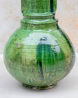 Sculptural green pottery vase with rounded base