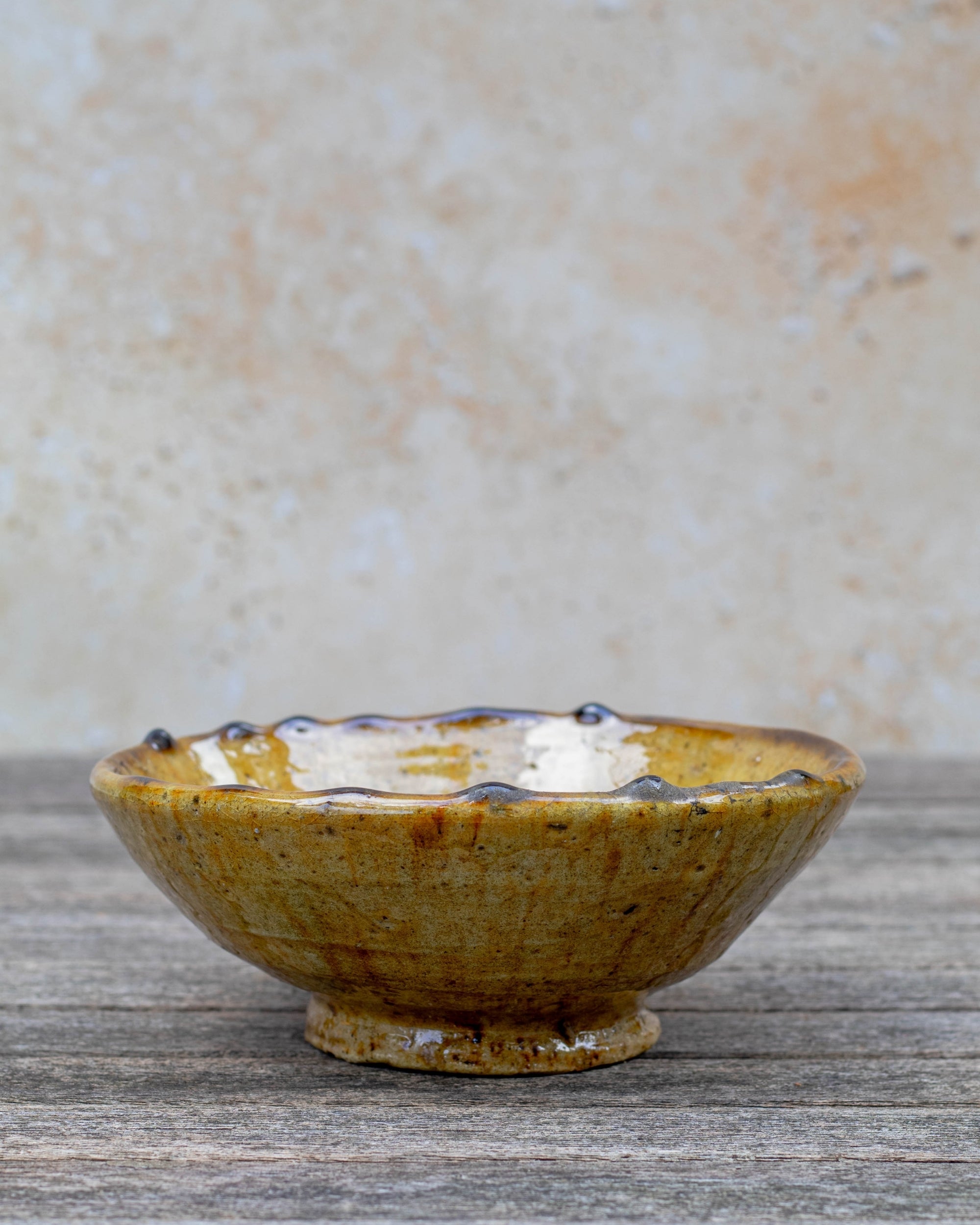 Side profile of Tamegroute ochre bowl showing depth and base