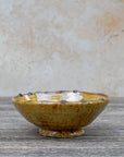 Side profile of Tamegroute ochre bowl showing depth and base