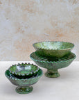 Side profile of bowl showing scalloped rim and raised base