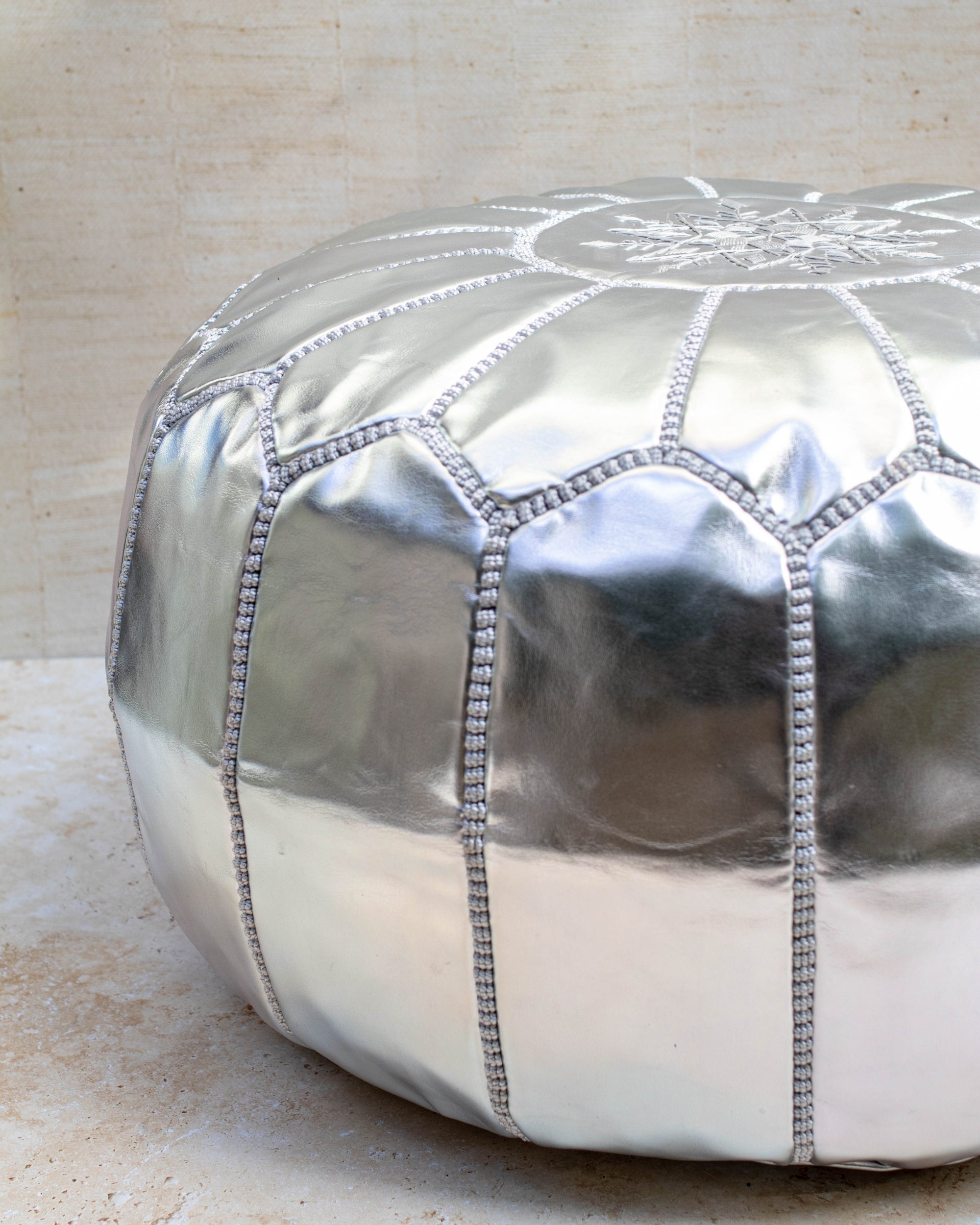 Silver Moroccan pouf – close-up of hand stitching