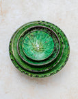 Stacked Tamegroute green bowls showing handmade glaze variations