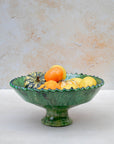 Stacked Tamegroute green pedestal bowls showing handmade glaze variations