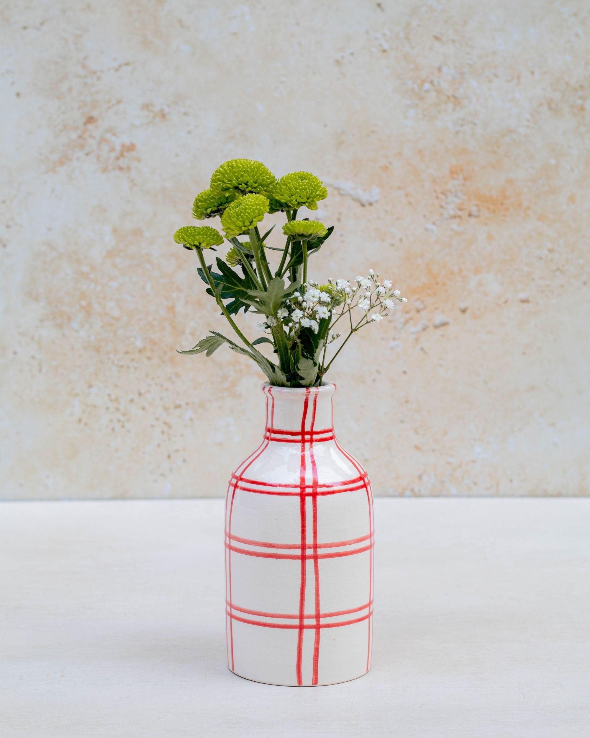 Styled ceramic vases on stone blocks