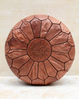 Tan Moroccan leather pouf — front view