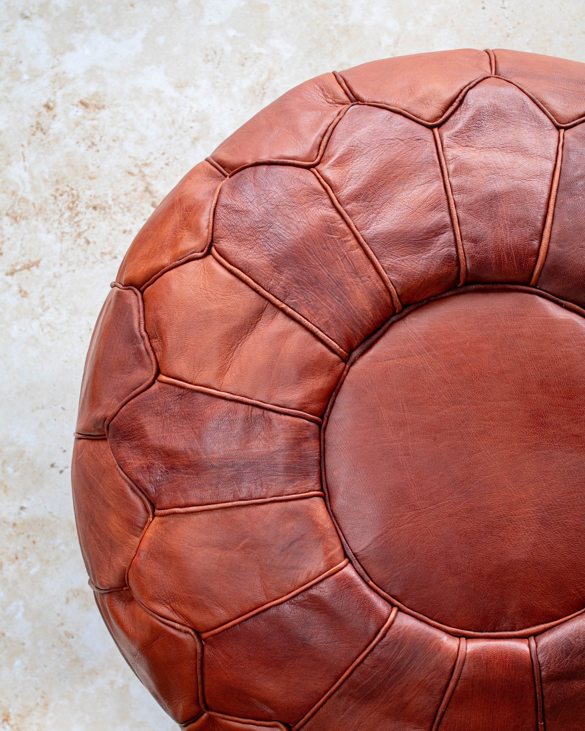 Tan leather pouf – stitching detail close up