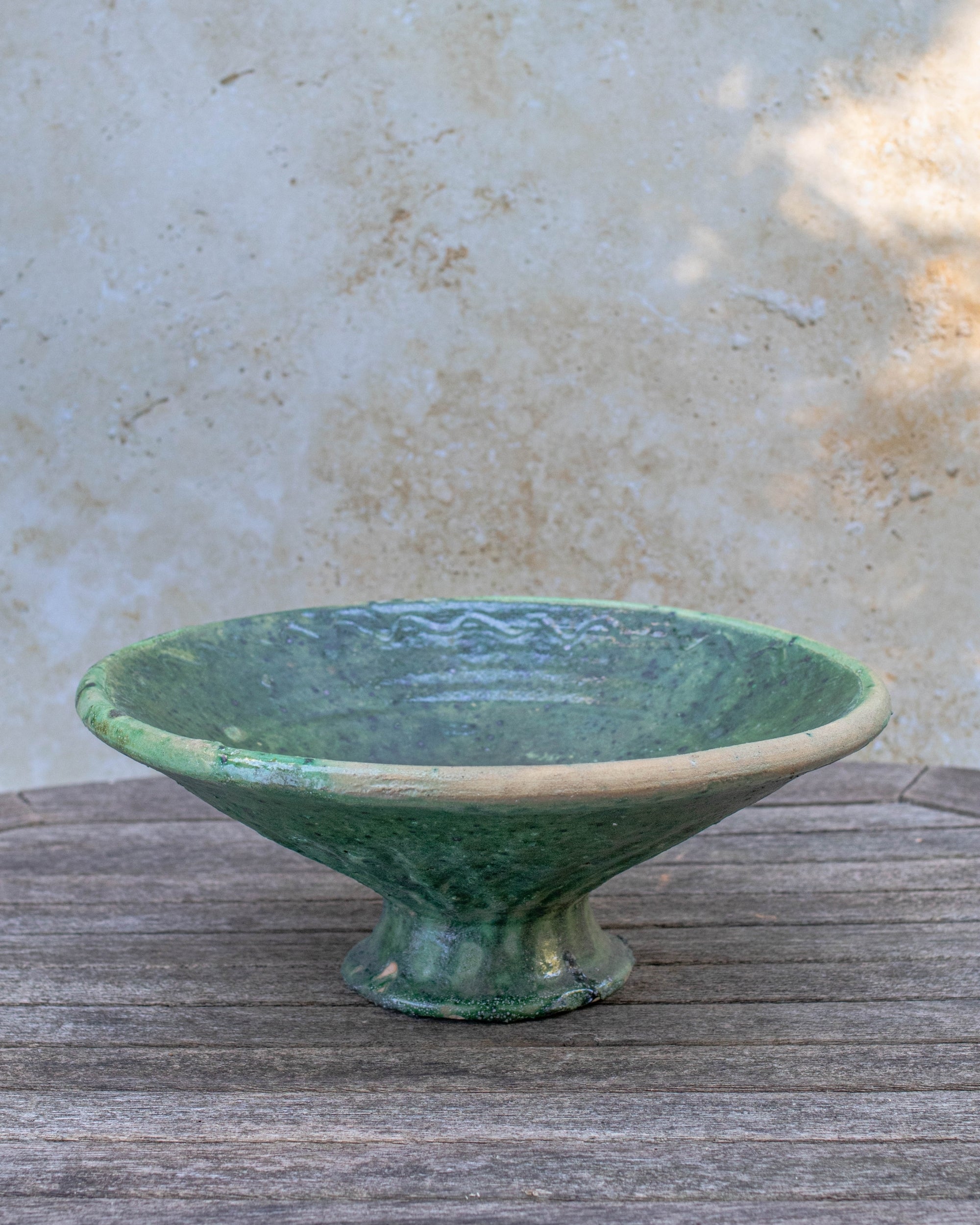 Top view of handcrafted Moroccan green bowl showing texture