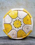 Yellow and cream Moroccan leather pouf with gold embroidery front view