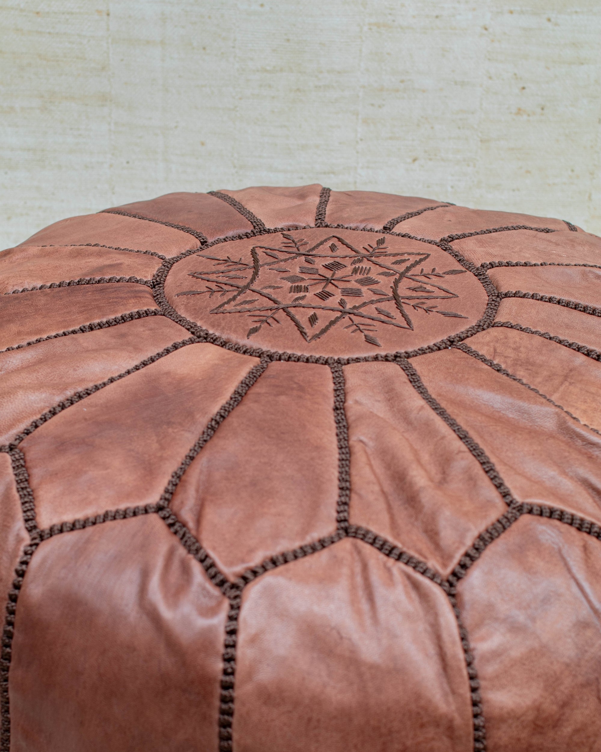 Zip closure at base — leather pouf