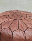 Zip closure at base — leather pouf