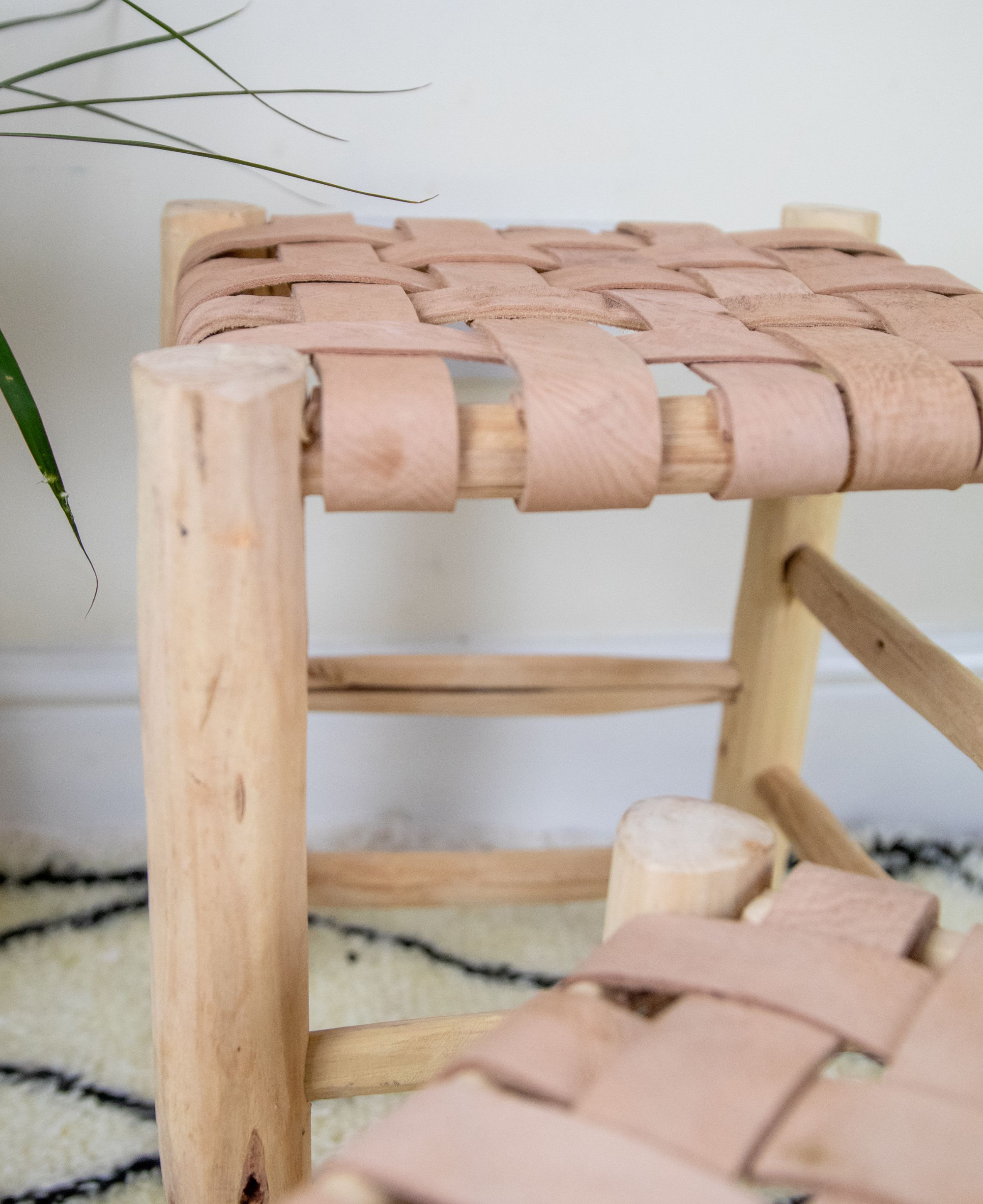 Boho Chic Wooden Stool with Braided Leather Seat - Handmade Moroccan FootstoolMoroccan Laurel Wood Footstool: Braided Leather Seating