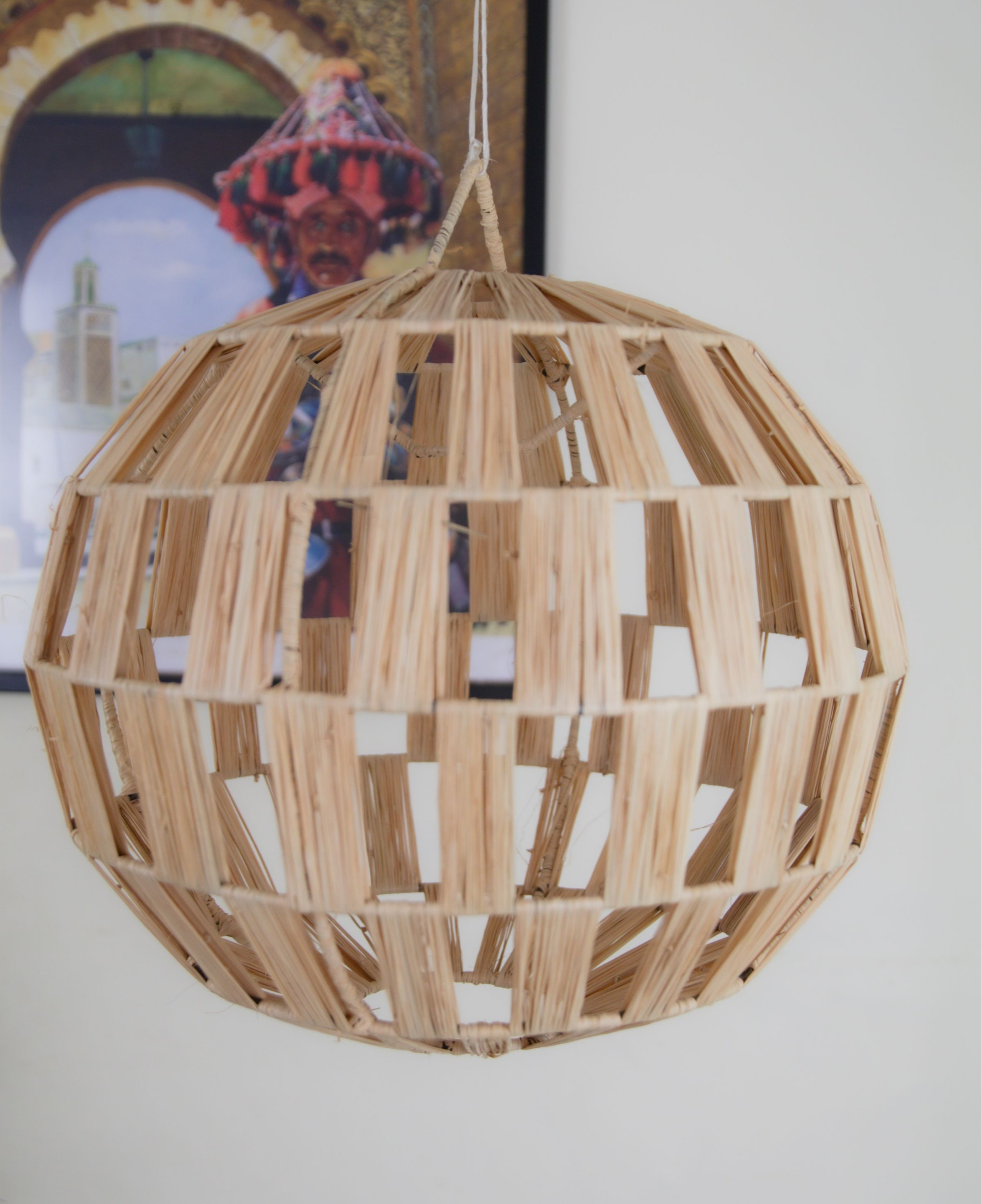 Elevate your space with our Bohemian Doum Suspension Rattan Lampshade. Handcrafted in Morocco from natural straw, this pendant light exudes authentic charm and warmth. Its intricate design allows for a soft, inviting glow, perfect for creating a cozy ambiance in any room. Bring a touch of Moroccan craftsmanship to your decor with this unique piece.