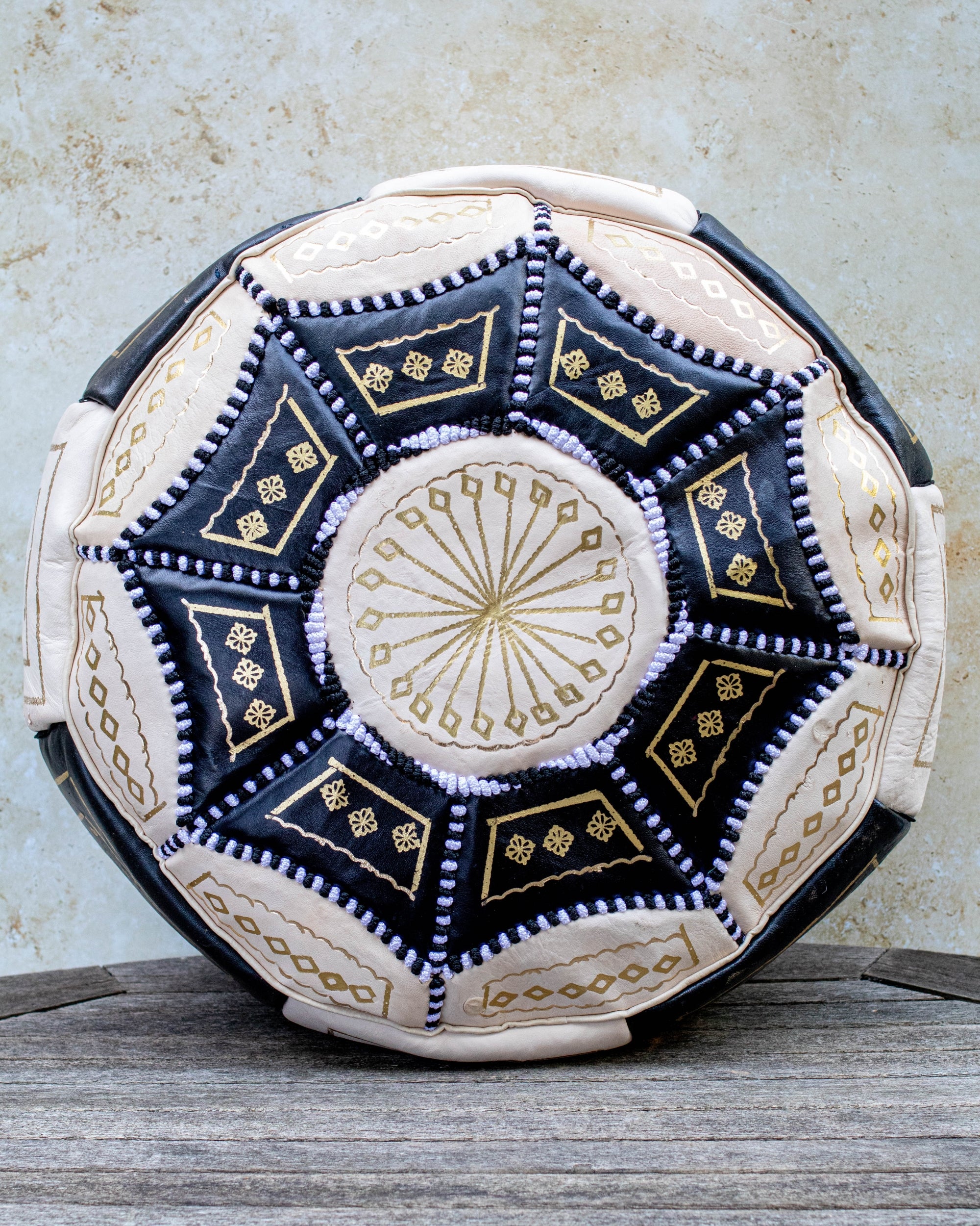 Black and cream Moroccan leather pouf with gold embroidery – front view