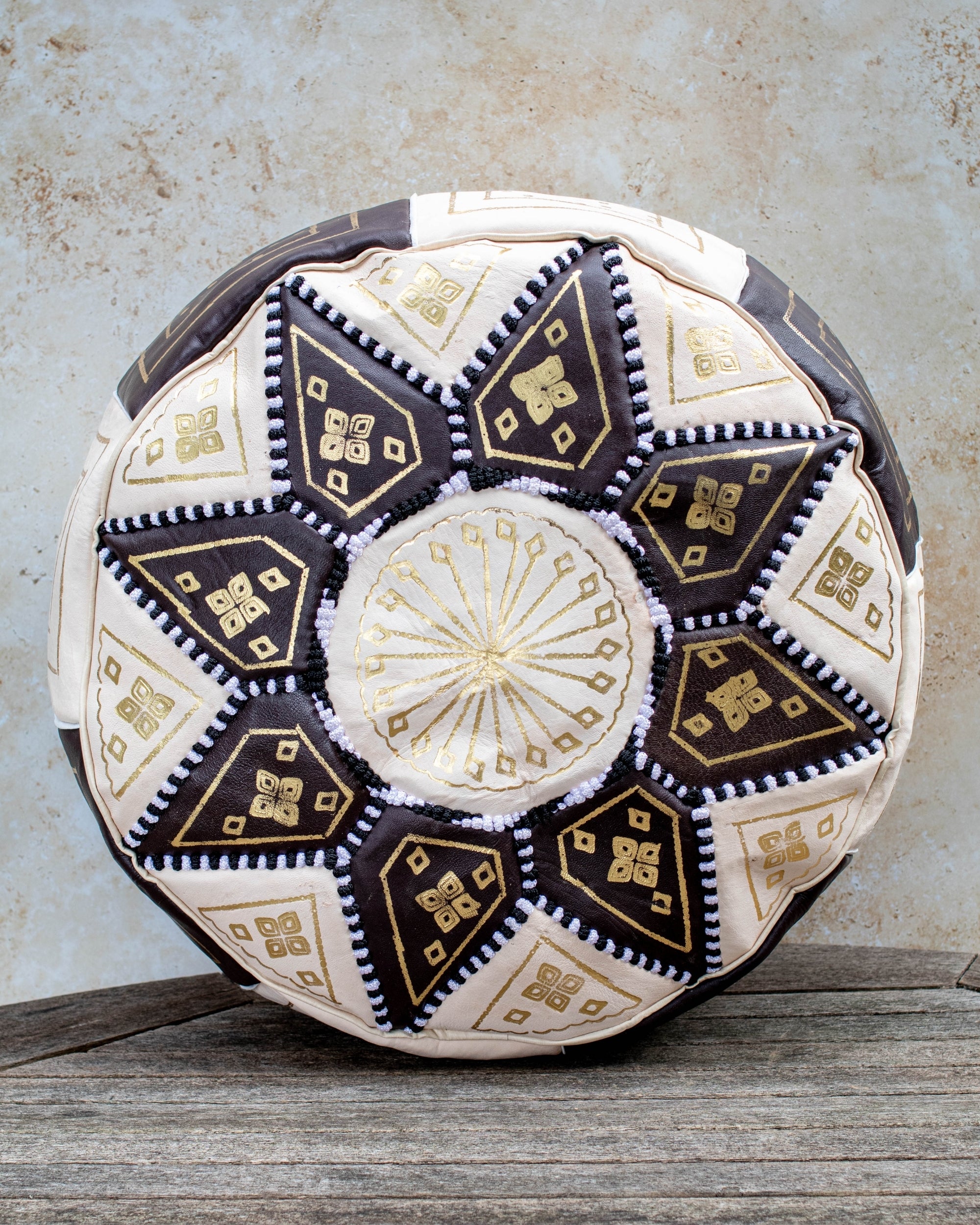 Brown and cream Moroccan leather pouf with gold embroidery front view