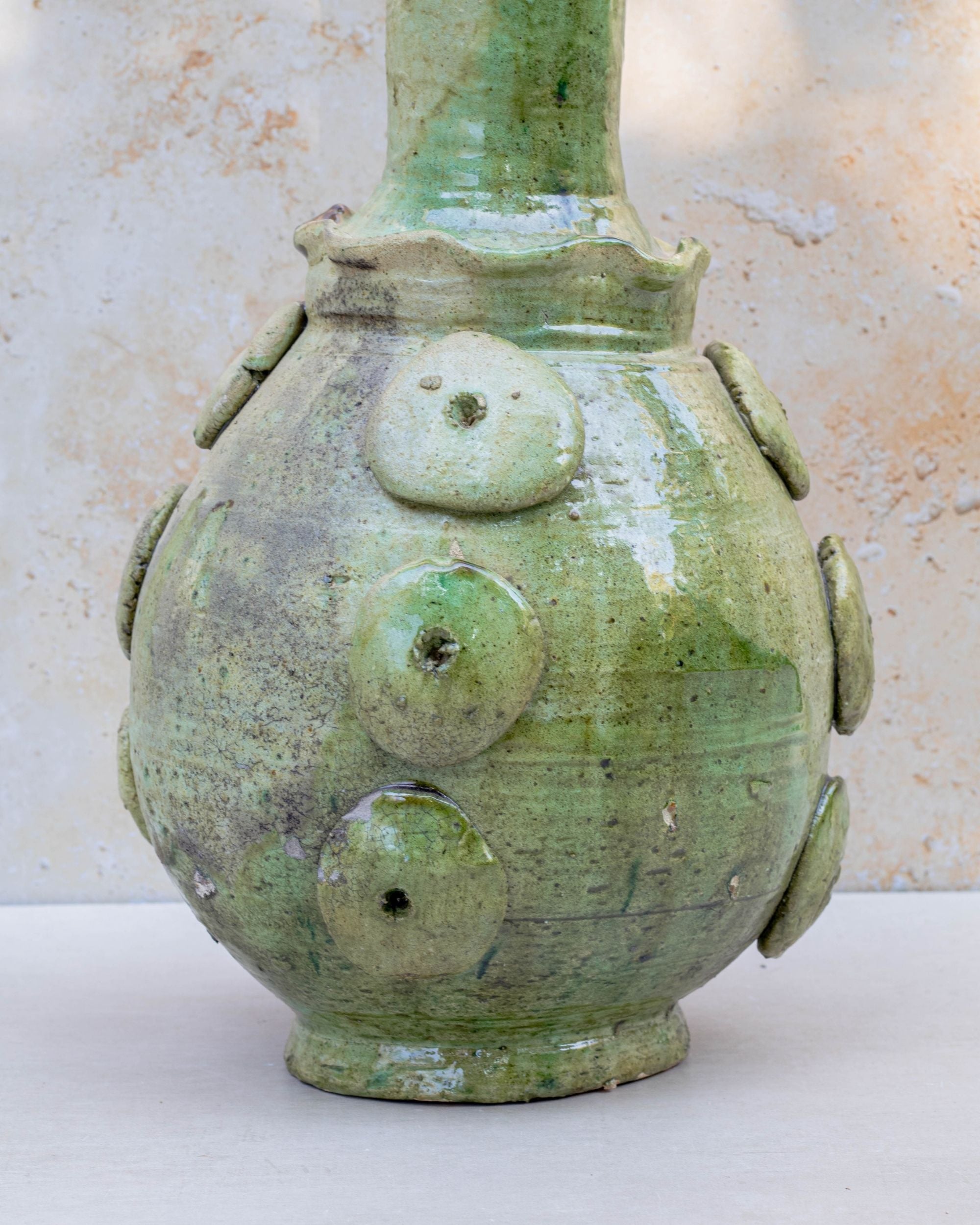 Hand-thrown Tamegroute vase showing glaze variations and surface texture