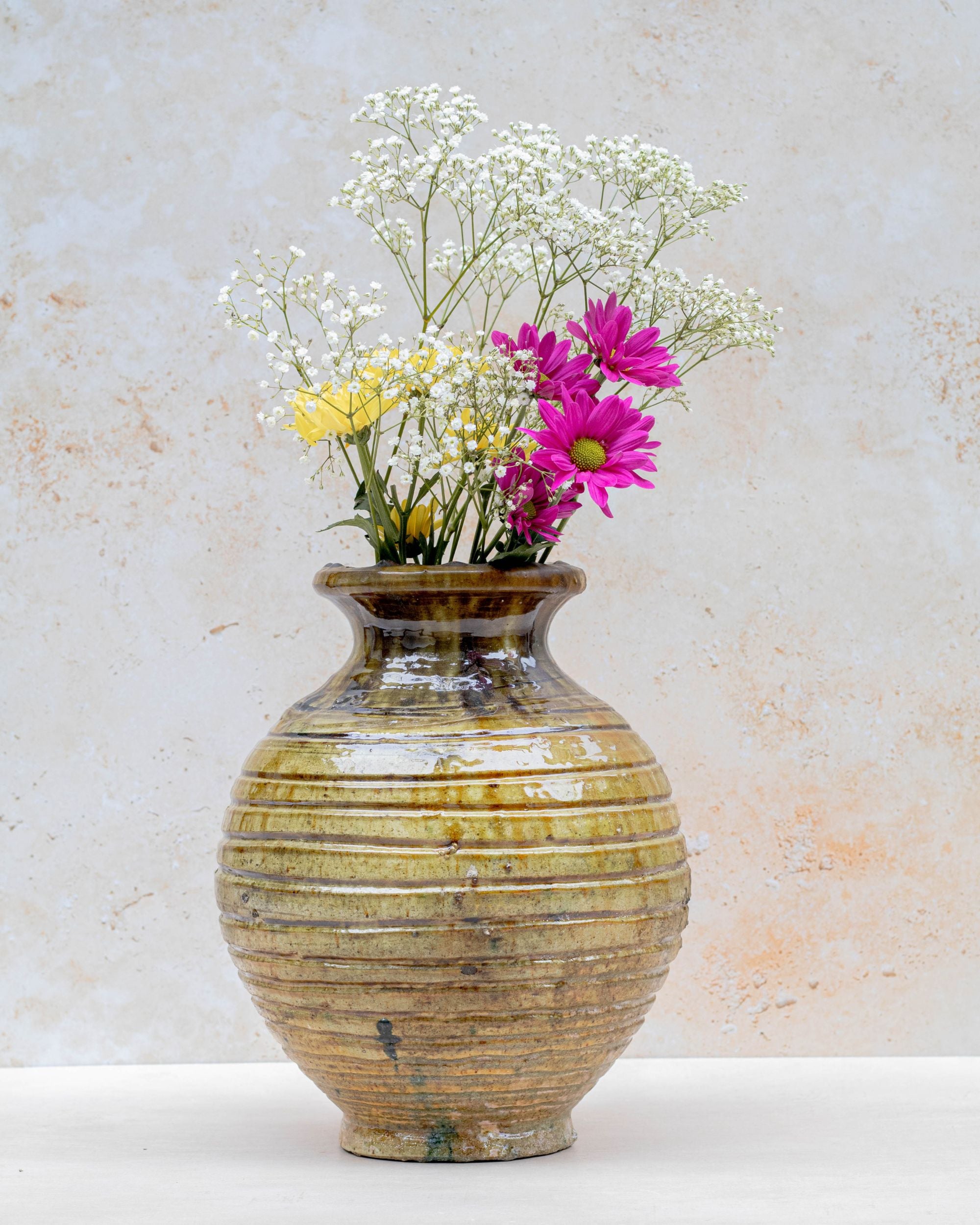 Handmade Tamegroute ribbed vase in ochre glaze
