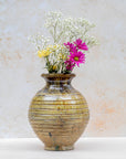Handmade Tamegroute ribbed vase in ochre glaze