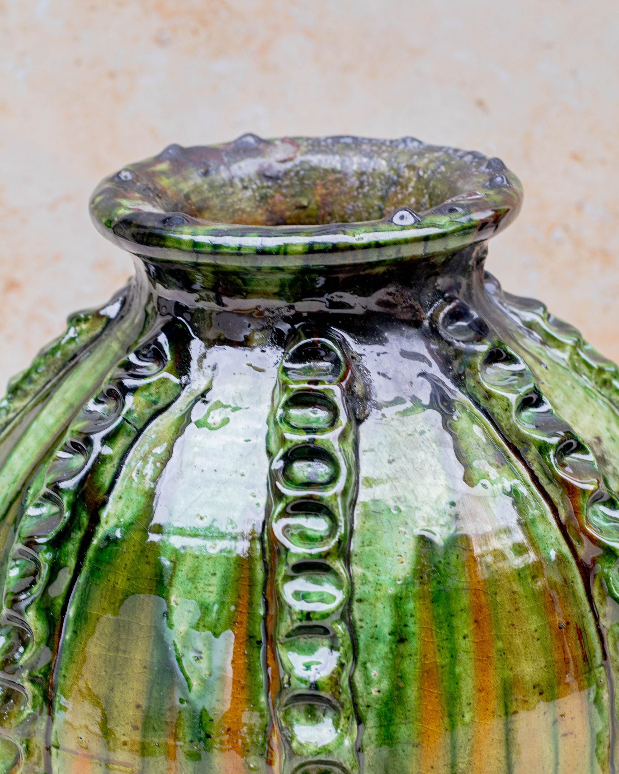 Moroccan pottery vase with ribbed relief and green glaze