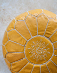Mustard leather pouf stitching detail close up